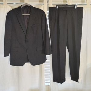 Brooks Brothers black pinstripe suit.         U.S 42s/37. E.U 54/47